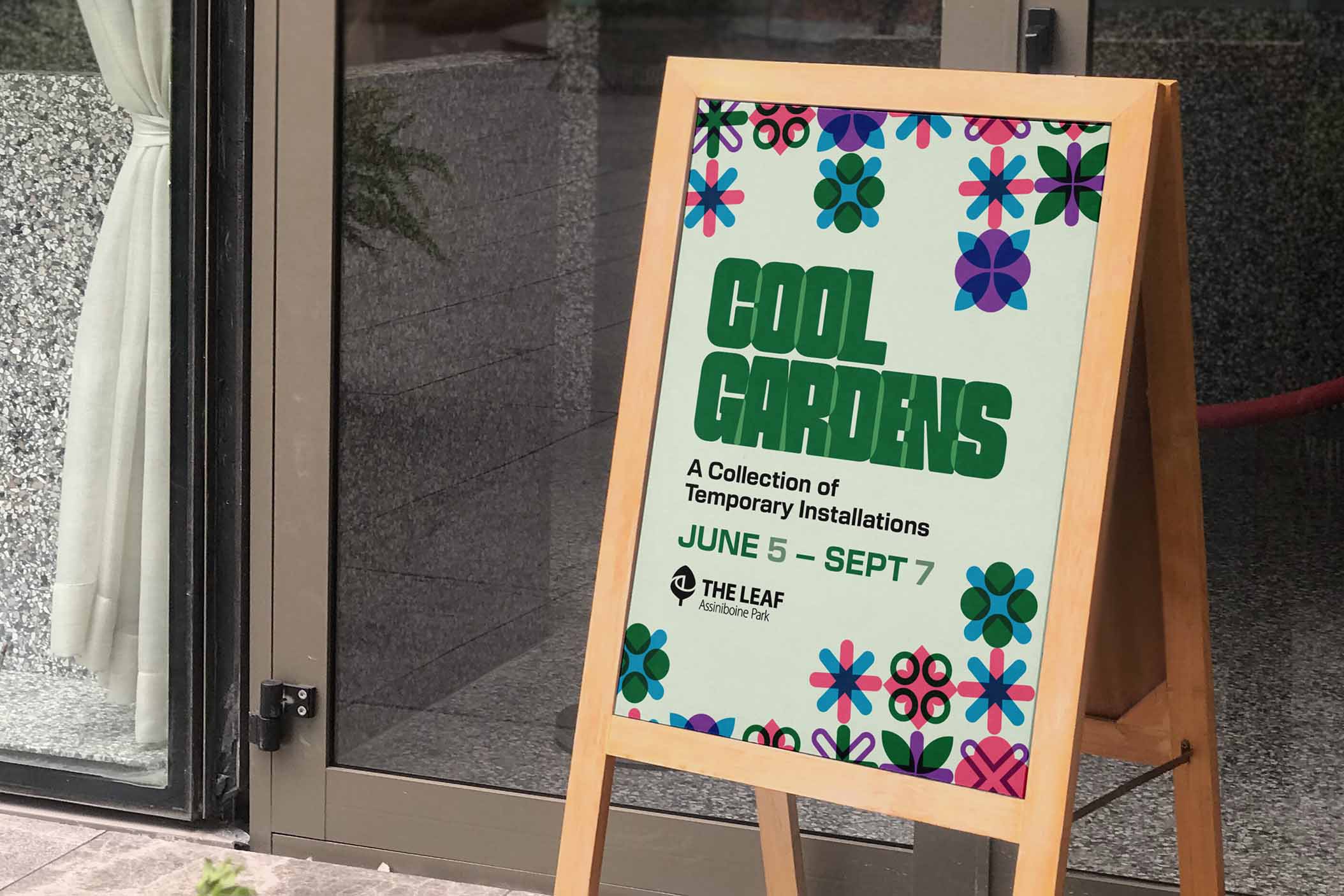 A sandwich board displayed outdoors advertising the Cool Gardens Event