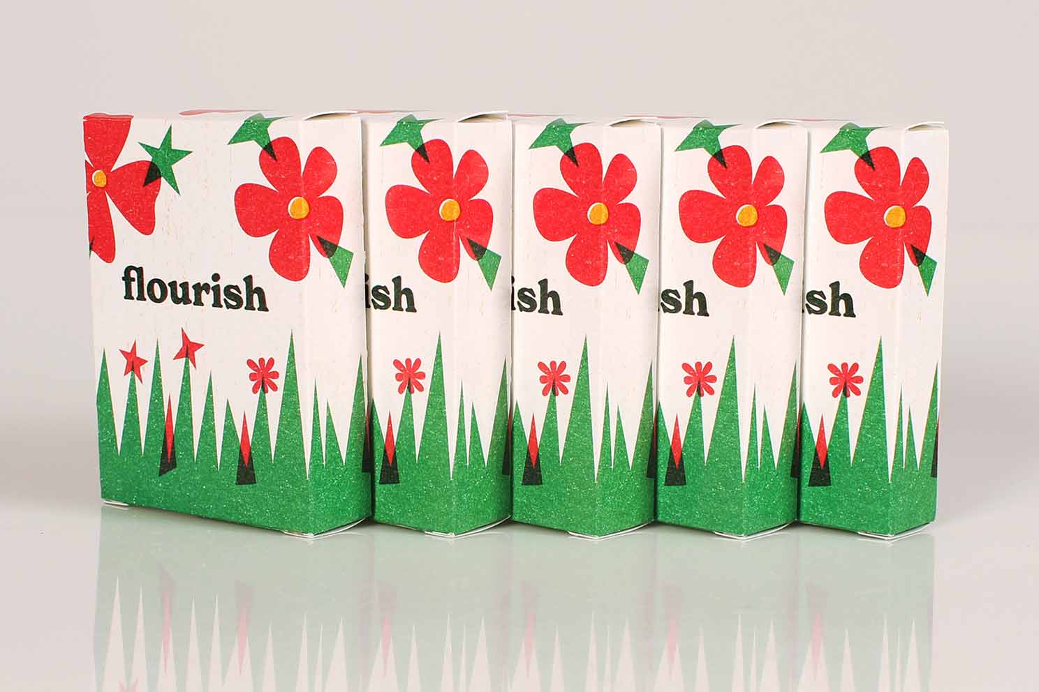 Five boxes of Flourish Playing cards in a row